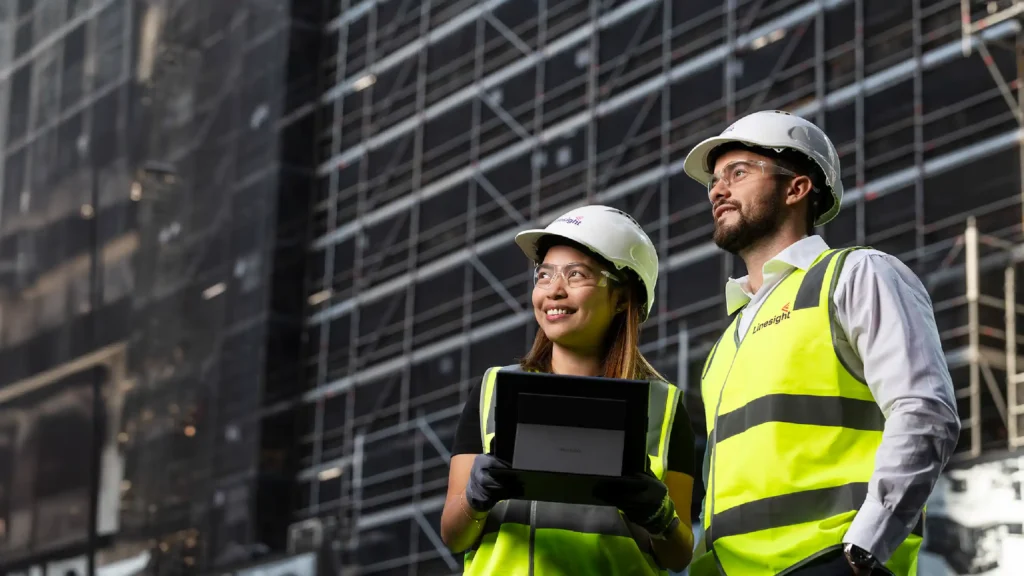 Construction worker standing in front of the building